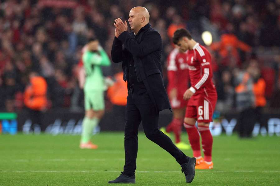 Arne Slot applauds the Liverpool fans after his side's Champions League win over Real Madrid. Arne Slot applauds the Liverpool fans after his side's Champions League win over Real Madrid.
