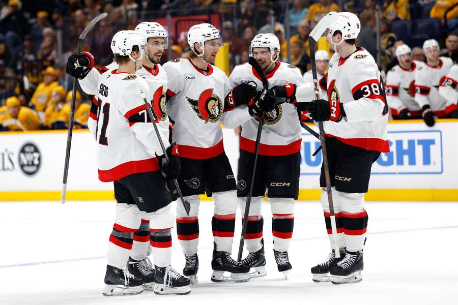 Ottawa Senators players celebrating a goal against the Nashville Predators