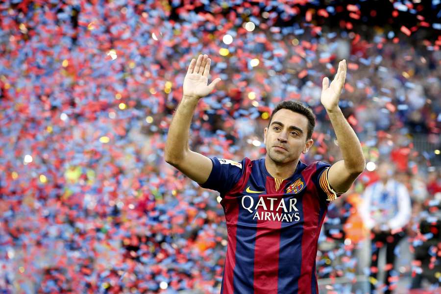 Xavi back in his playing days with Barcelona