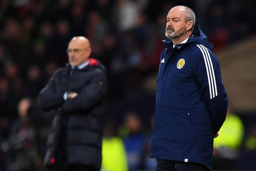 Spain's coach Luis de la Fuente (L) and Scotland's head coach Steve Clarke