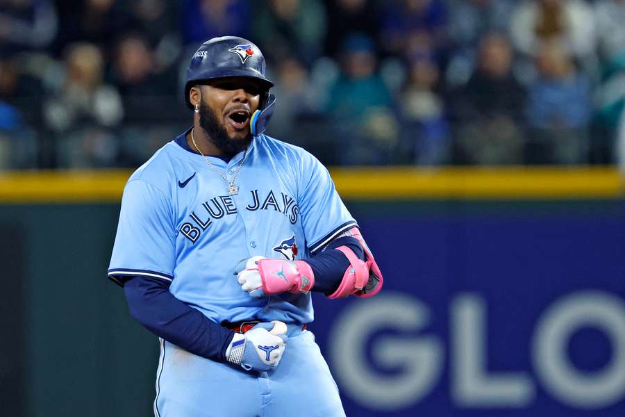 Blue Jays' Vladimir Guerrero Jr. reacts after his fourth hit in Game 3 of the 2025 ALCS