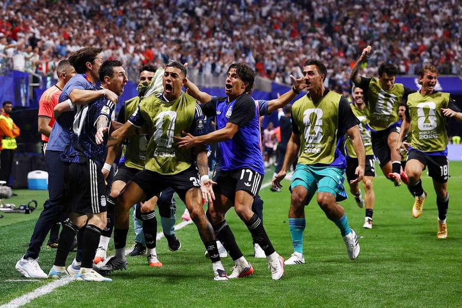 Argentina's Lionel Messi celebrates with teammates after Lautaro Martinez scores the winner against England