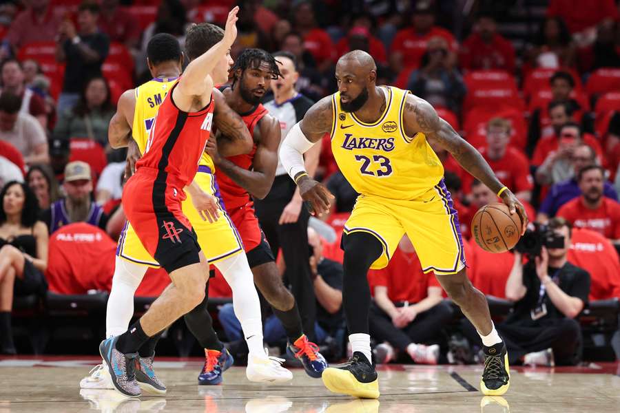 Los Angeles Lakers forward LeBron James dribbles the ball during the first quarter against the Houston Rockets