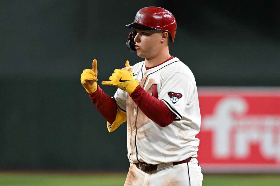 Joc Pederson hanging loose after hitting a single in a game against the Toronto Blue Jays
