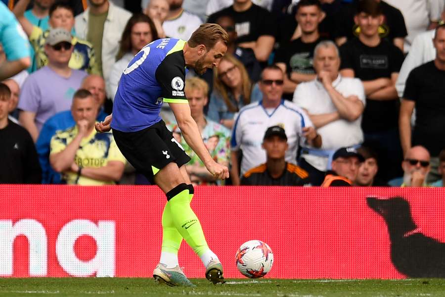 Tottenham Hotspur's English striker Harry Kane shoots to score their third goal