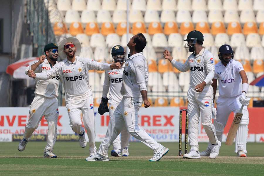 Pakistan players celebrate after the match