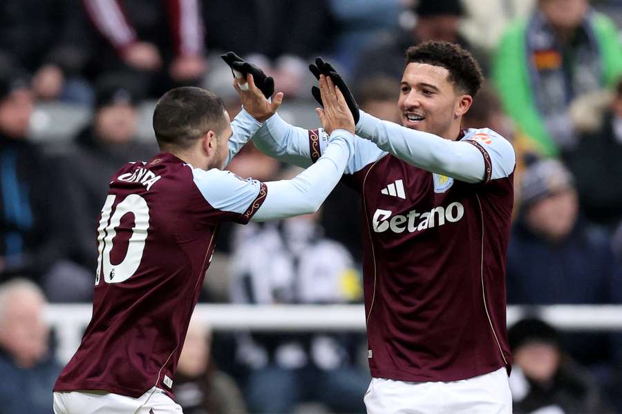 Emi Buendia celebrates scoring Aston Villa's opening goal with teammate Jadon Sancho