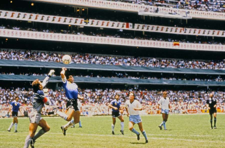 Argentina's Diego Maradona scores against England with his hand at the 1986 FIFA World Cup in Mexico Argentina's Diego Maradona scores against England with his hand at the 1986 FIFA World Cup in Mexico