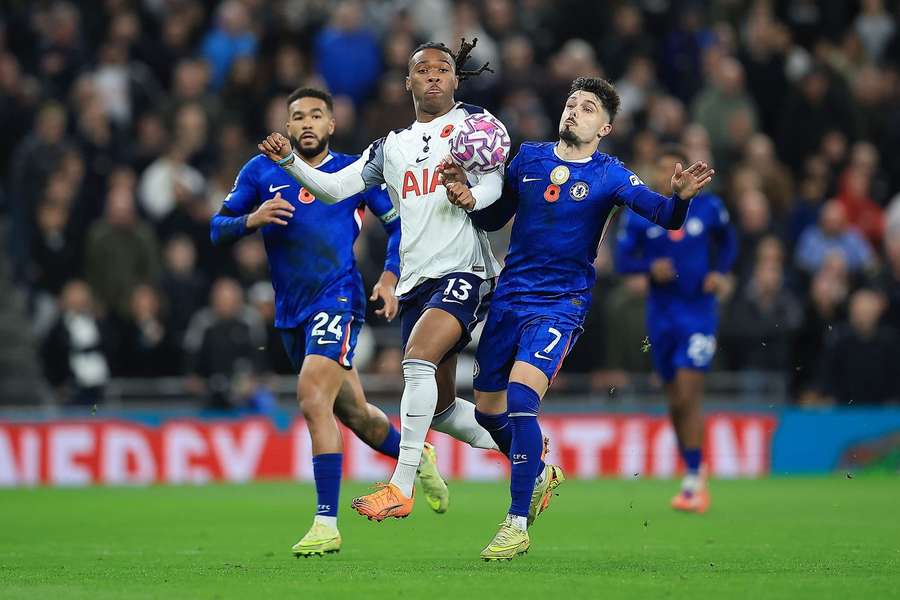 Tottenham Hotspur's Destiny Udogie challenges Chelsea's Pedro Neto