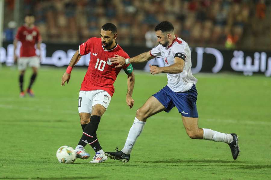 Cape Verde captain Roberto Lopes challenges Egypt's Mohamed Salah.