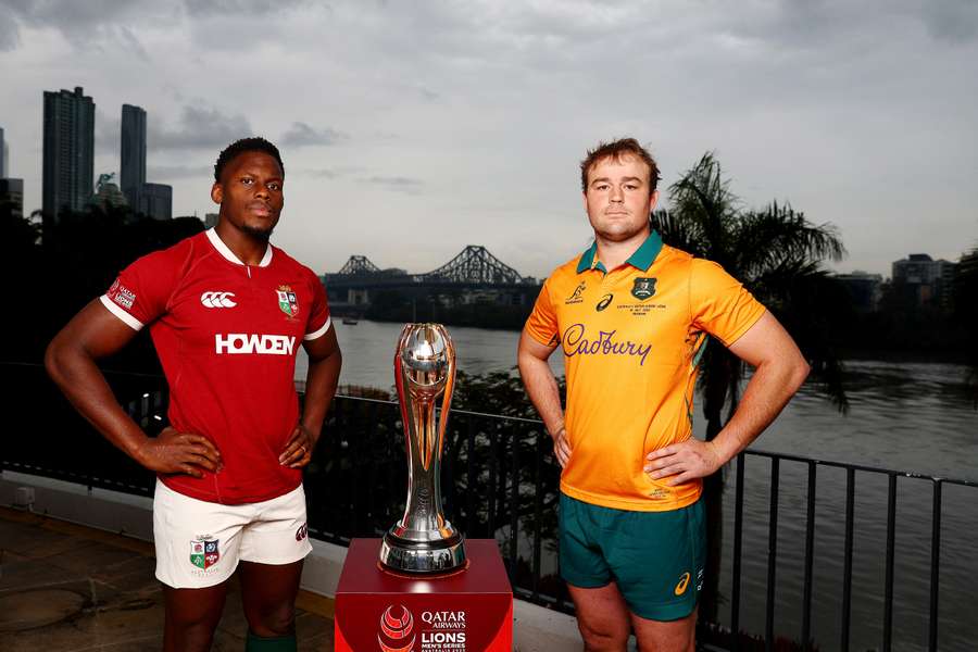 Captains Maro Itoje and Harry Wilson pose with the trophy in Brisbane.