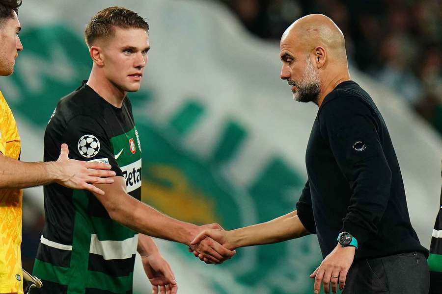 Head Coach Josep Guardiola of Manchester City congratulates goal scorer Viktor Gyokeres