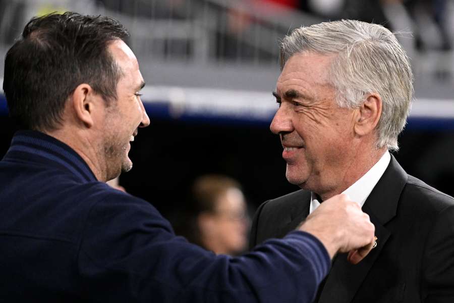 Real Madrid coach Carlo Ancelotti (R) greets Chelsea coach Frank Lampard