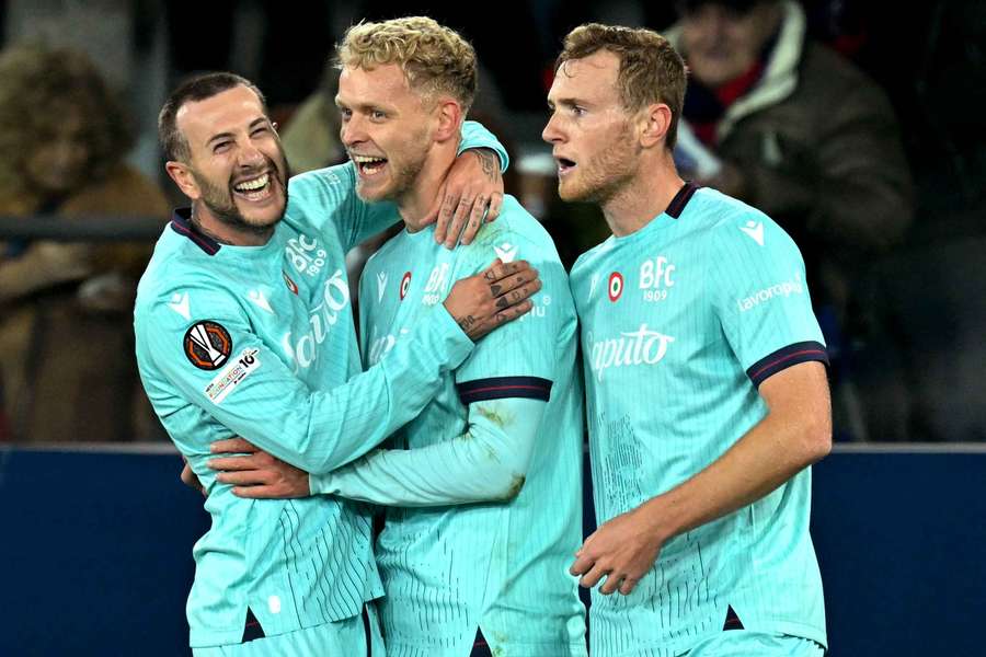 Bologna's Jens Odgaard (centre) celebrates scoring his team's first goal with Federico Bernardeschi and Tommaso Pobega