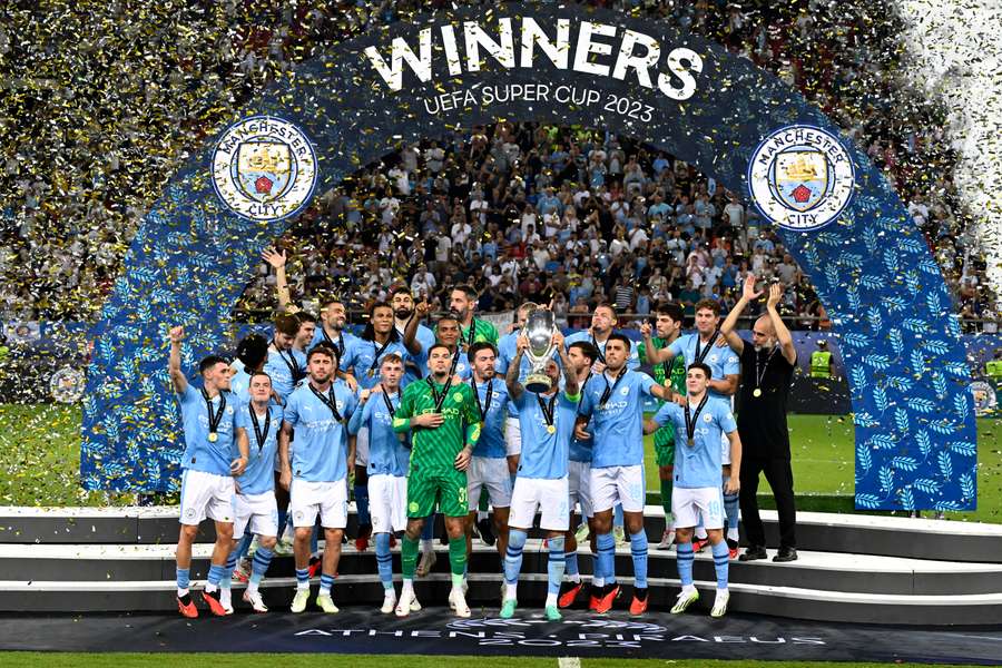 Manchester City players celebrate their victory after penalties