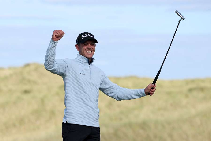 Grant Forrest celebrates his winning putt on the 18th green