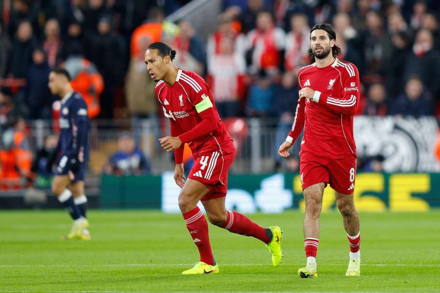 Liverpool captain Virgil van Dijk (L) believes Dominik Szoboszlai can become a 'leader' at Anfield