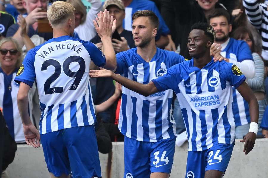 Brighton's Simon Adingra (R) celebrates scoring the team's third goal 