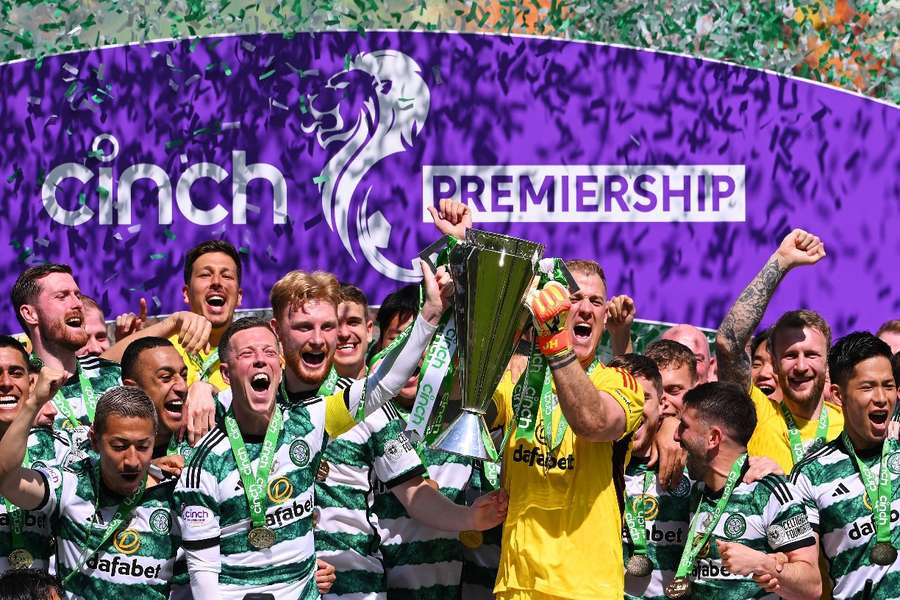 Celtic's players celebrate lifting the title