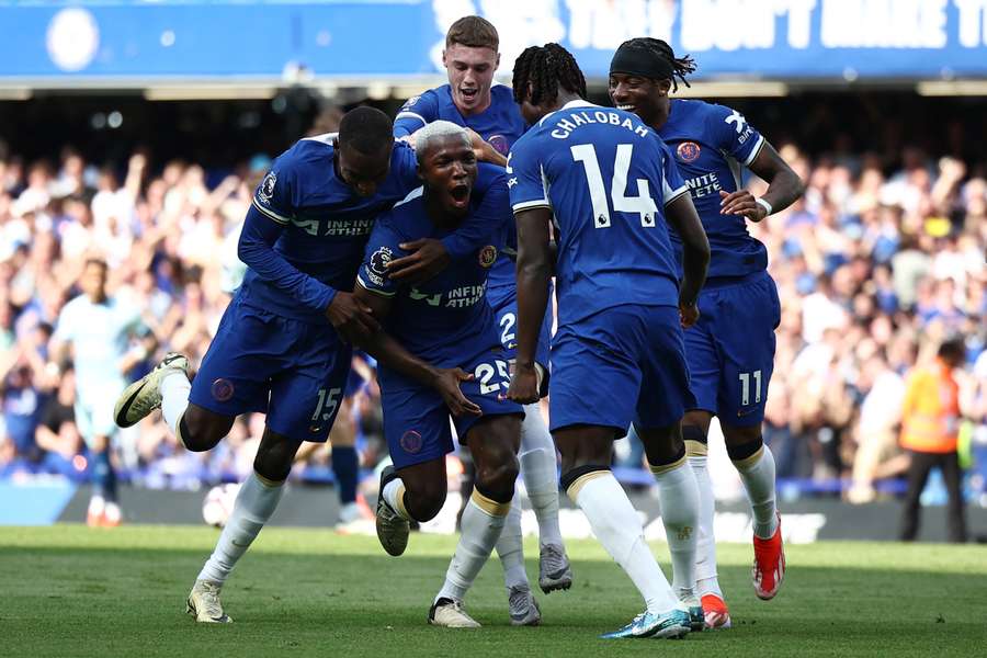 Moises Caicedo, second left, celebrates with his team after scoring the opening goal