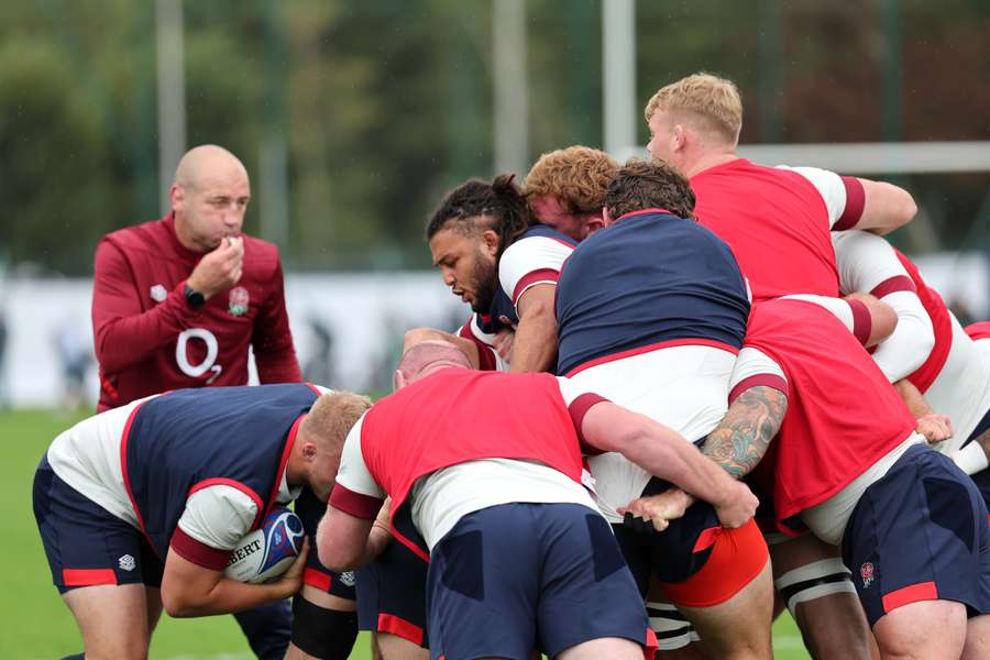England players practice a rolling maul overseen by England's coach Steve Borthwick