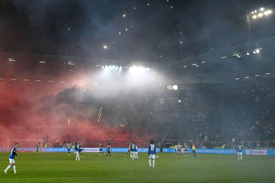 Fans let off fireworks during the Hamburg derby