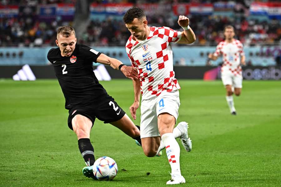 Canada's Alistair Johnston tackles Croatia's Ivan Perisic in the World Cup.