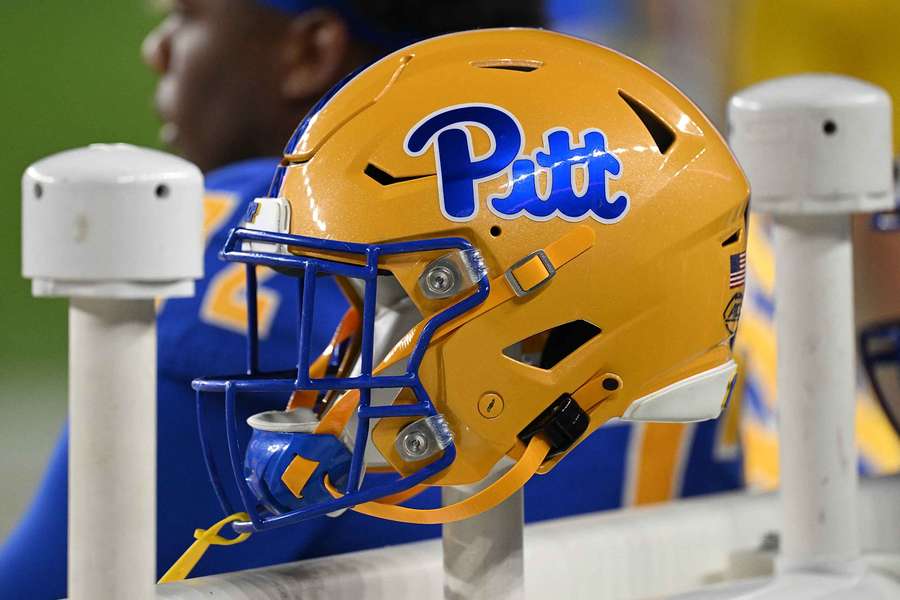 University of Pittsburgh football helmet hung on the sidelines during a game. (2023)