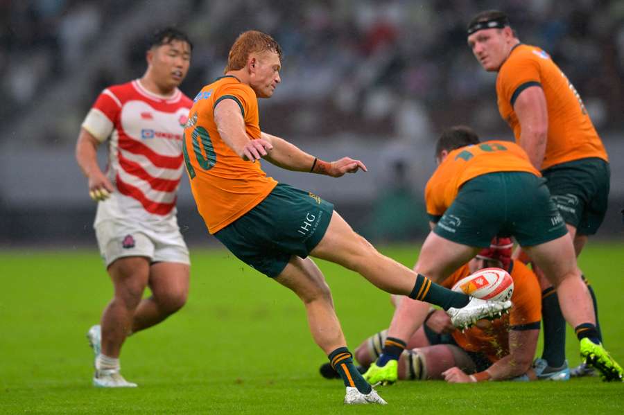 Wallabies flyhalf Tane Edmed hoofs the ball against Japan last weekend. Wallabies flyhalf Tane Edmed hoofs the ball against Japan last weekend.