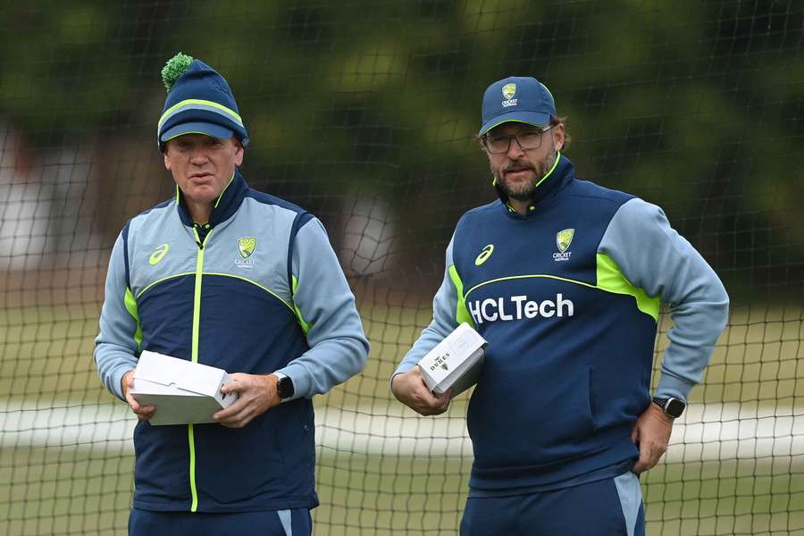 Australia head coach Andrew McDonald and assistant Daniel Vettori watch on during a training session. 