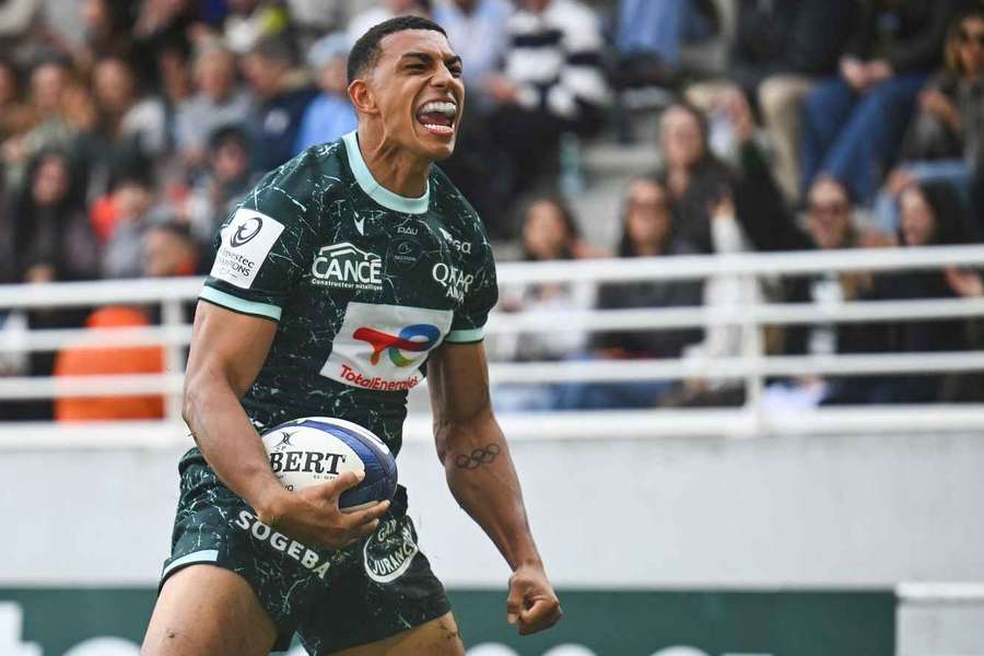 Pau's French wing Aaron Grandidier celebrates after scoring a try Pau's French wing Aaron Grandidier celebrates after scoring a try