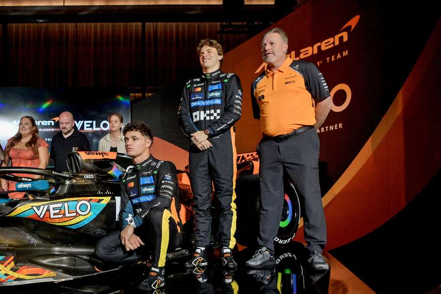 McLaren's Lando Norris, Oscar Piastri and chief executive Zak Brown ahead of the Abu Dhabi Grand Prix 