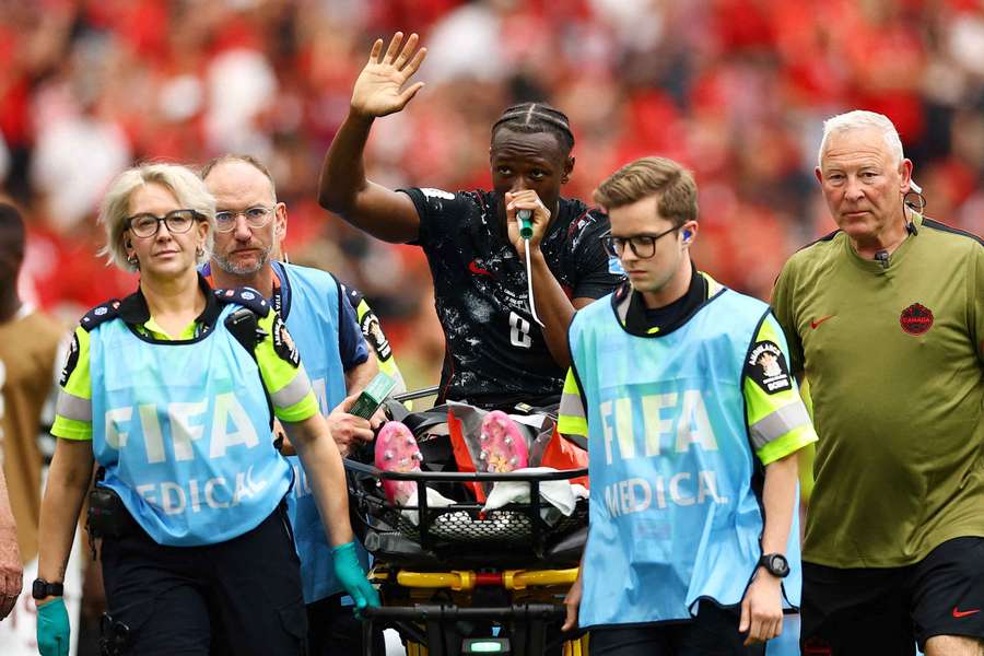 Canada's Ismael Kone waves to the crowd as he receives oxygen as he is stretchered off after sustaining an injury Canada's Ismael Kone waves to the crowd as he receives oxygen as he is stretchered off after sustaining an injury