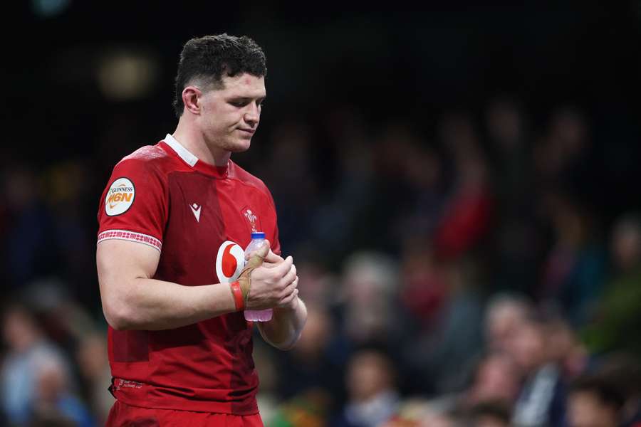 James Botham of Wales looks dejected as he applauds the fans after defeat to Scotland