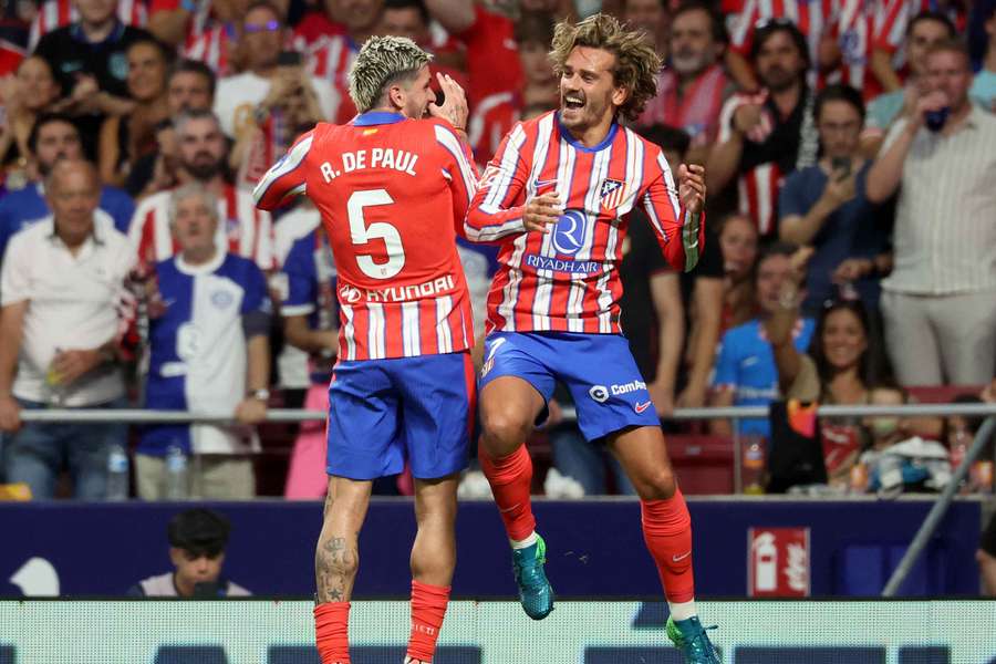 Atletico Madrid's Antoine Griezmann celebrates scoring his team's second goal with Rodrigo De Paul