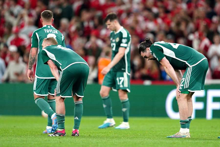 Northern Ireland players look dejected following defeat