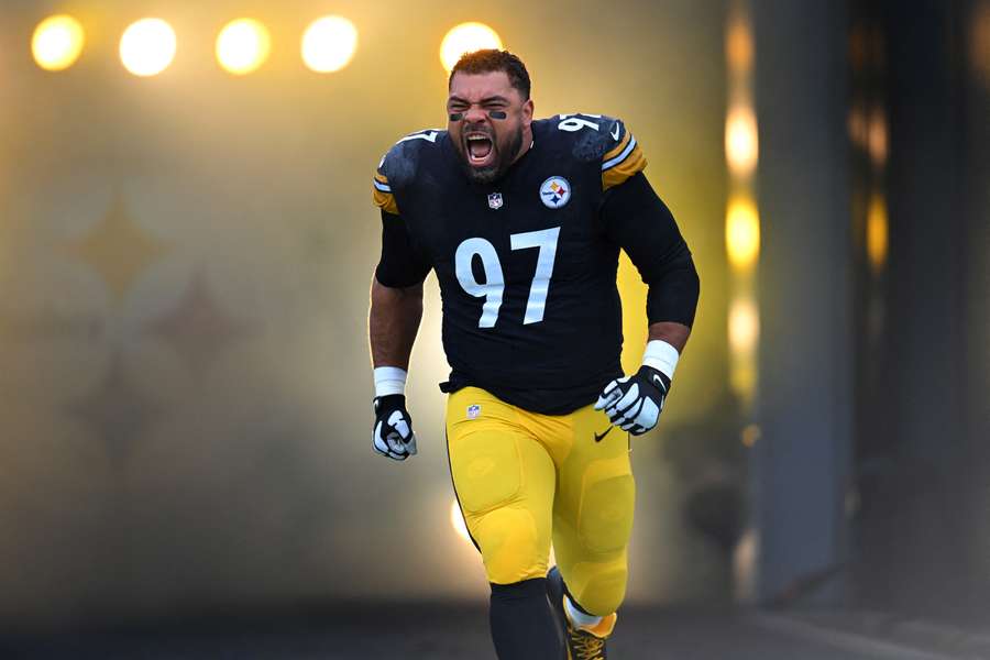 Steelers' Cam Heyward runs onto the field before a game