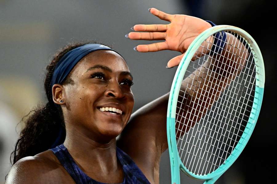 Coco Gauff celebrates after beating Lois Boisson