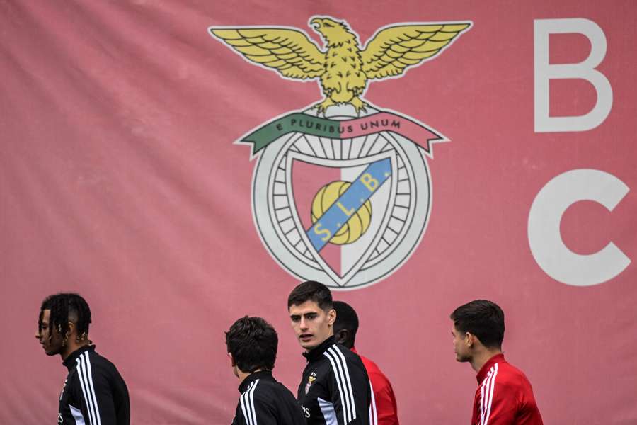 Benfica's Portuguese defender Antonio Silva (C) arrives with teammates for a training session