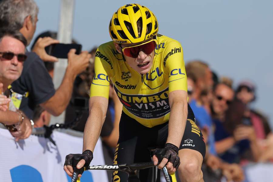 Jumbo-Visma's Danish rider Jonas Vingegaard reacts as he cycles to the finish line during the 9th stage