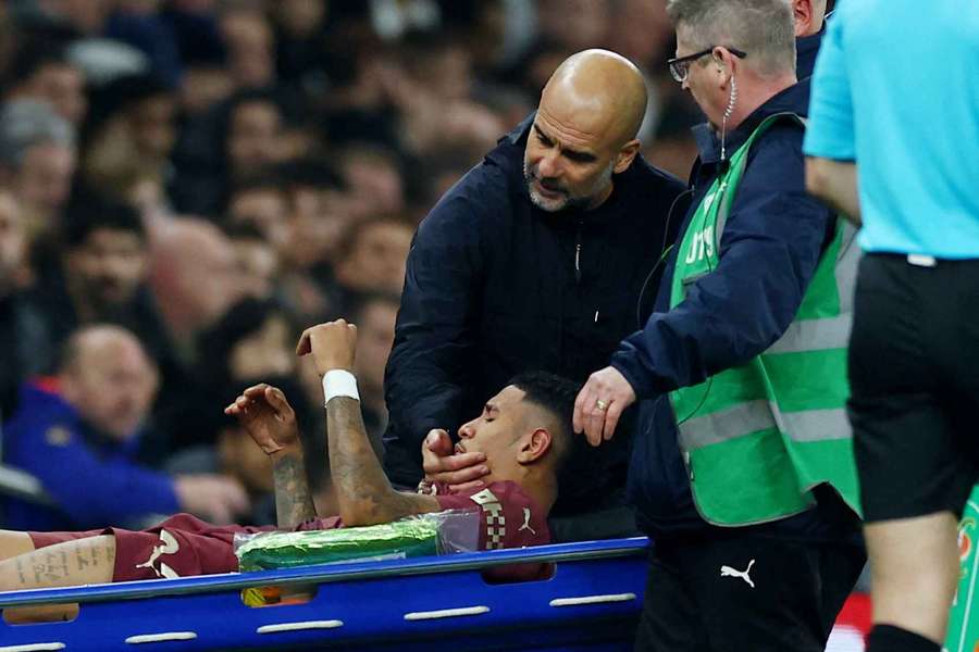 Pep Guardiola comforts Savinho after his injury during the week