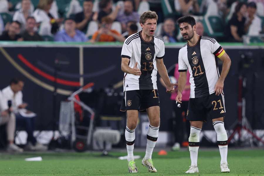 Germany's Ilkay Gundogan and Thomas Mueller react during the friendly football match between Germany and Japan