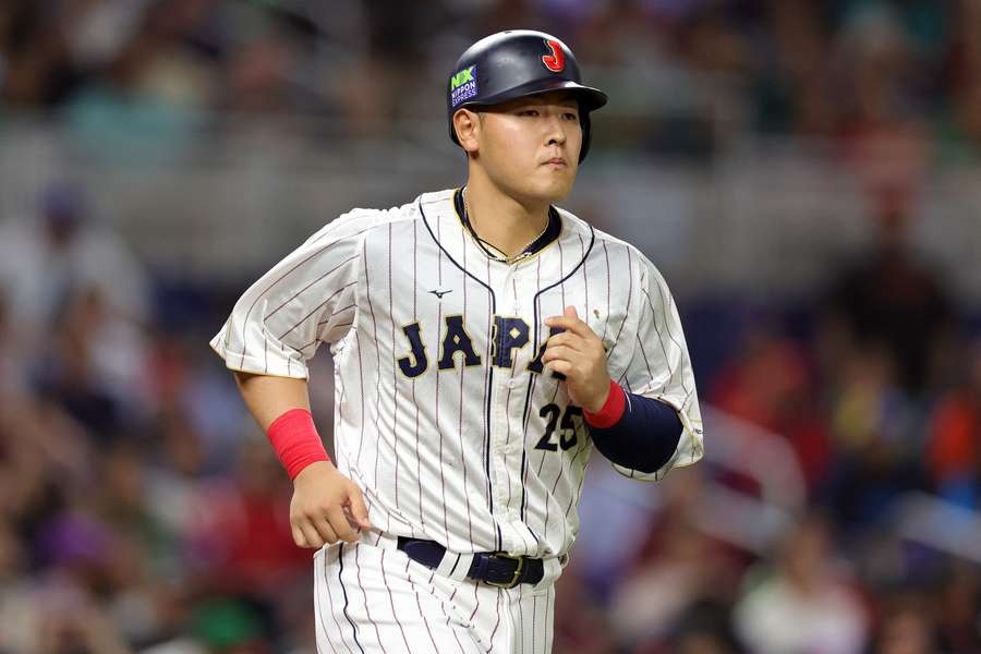 Kazuma Okamoto walks to first during 2023 World Baseball Classic
