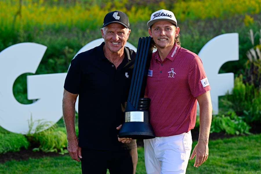 Cameron Smith (R) poses with LIV Golf CEO Greg Norman