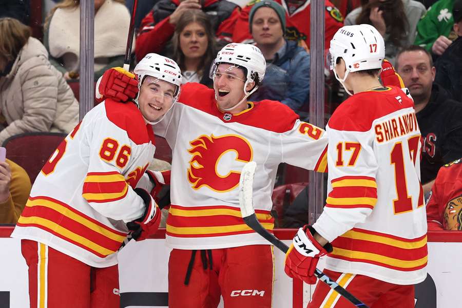Calgary Flames players celebrate after Jakob Pelletier's goal against the Chicago Blackhawks (2025)