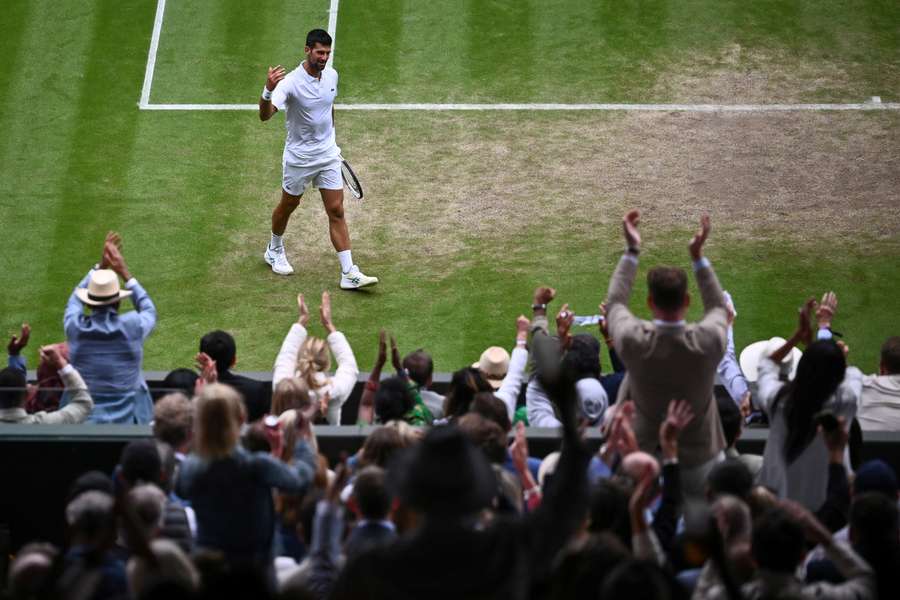 Novak Djokovic soaks up the applause during his quarter-final against Andrey Rublev