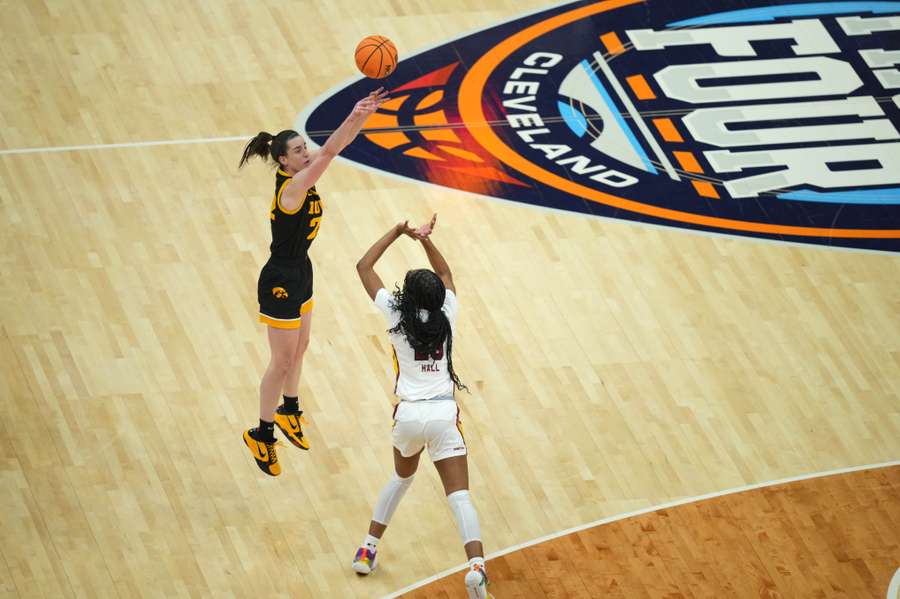 Iowa Hawkeyes guard Caitlin Clark shoots against South Carolina Gamecocks guard Bree Hall in the finals of the Final Four