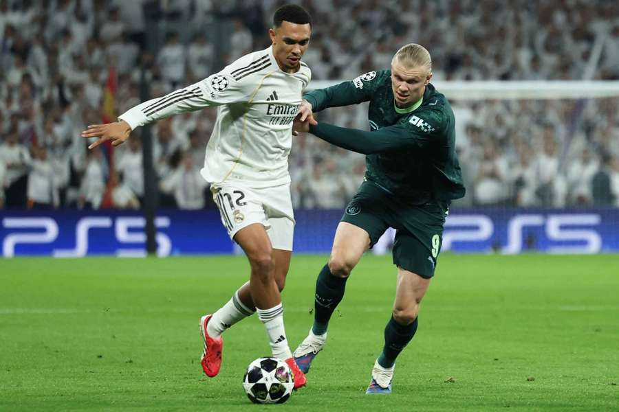 Real Madrid's Trent Alexander-Arnold in action with Manchester City's Erling Haaland