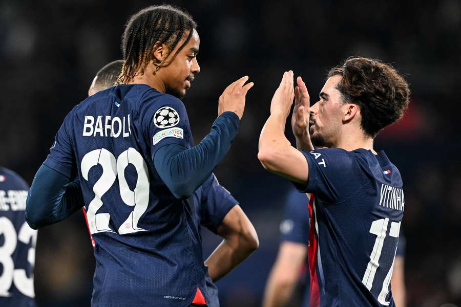 Paris Saint-Germain's French forward #29 Bradley Barcola (L) celebrates scoring his team's second goal