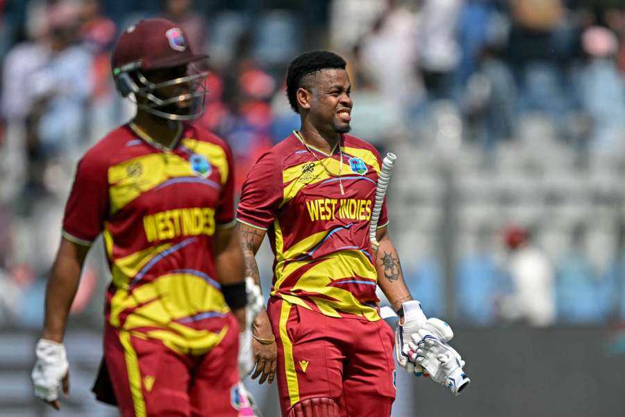 Shimron Hetmyer (right) and captain Shai Hope walk back after West Indies' win